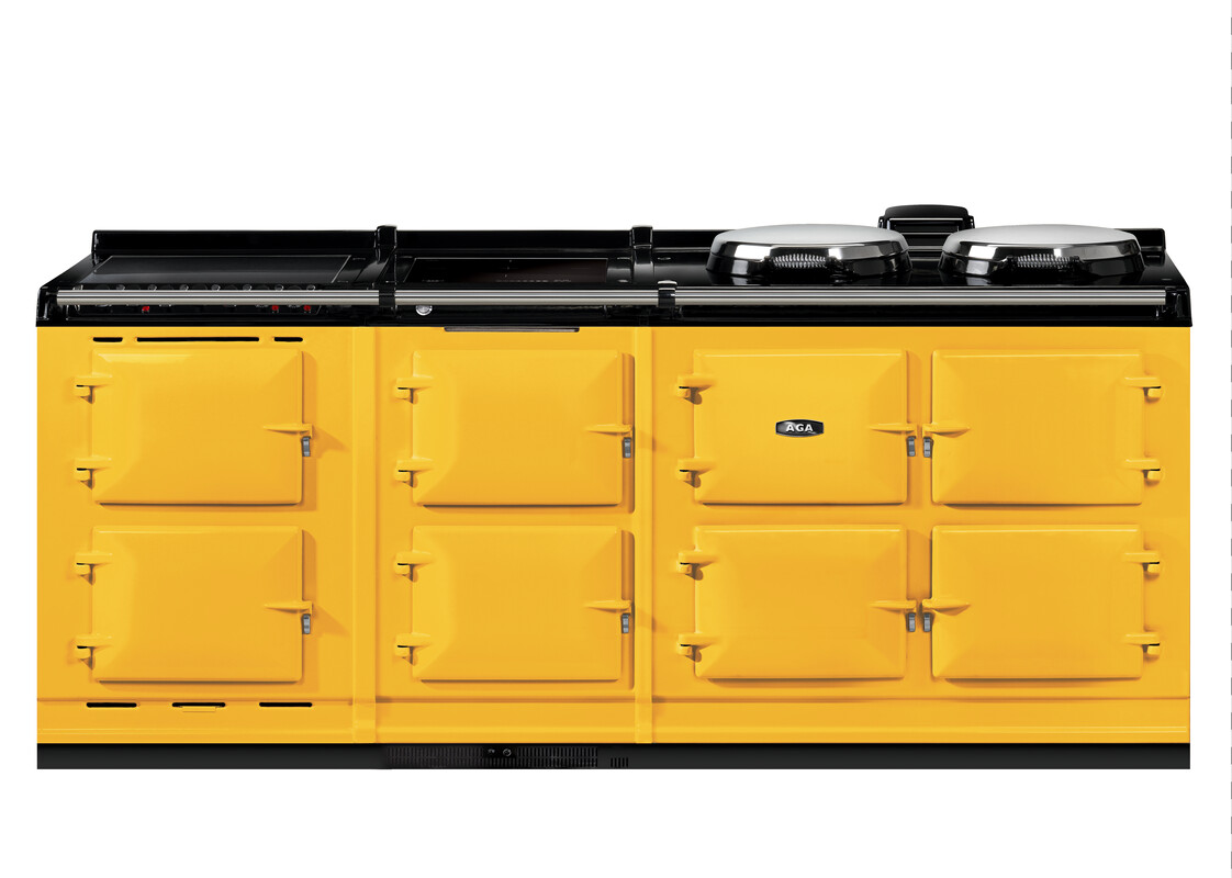 Gelber AGA-Herd mit mehreren Backöfen und zwei Kochplatten in traditionellem Design