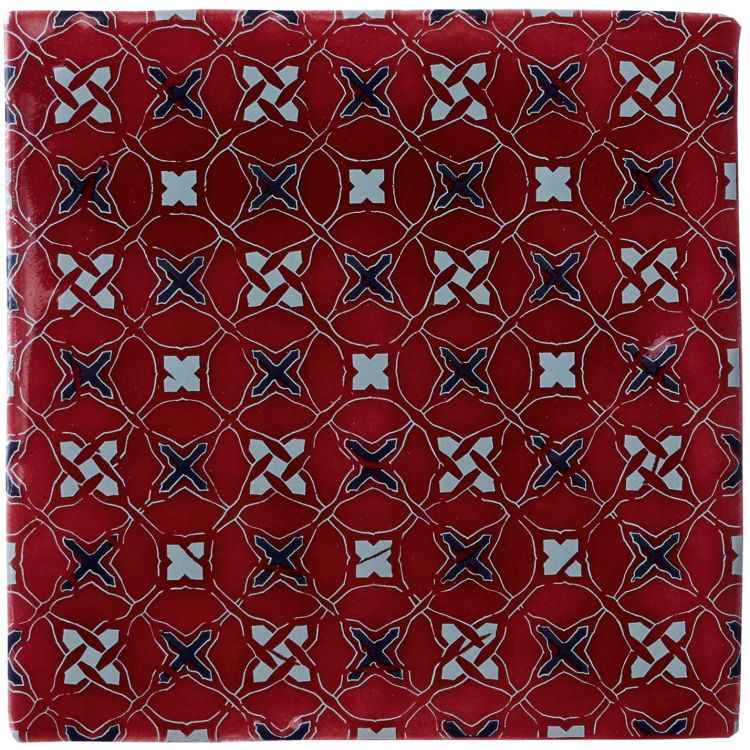 Rote Keramikfliese mit blau-weißem X-Muster, glasiert