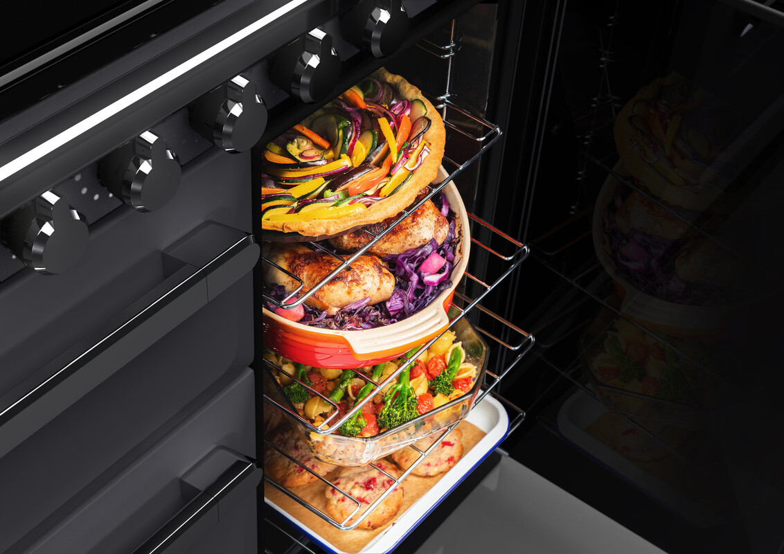 RS30220_Falcon Estel Deluxe 90 Induction-Open tall oven with mixed food content-scr.jpg?ts=1749819118