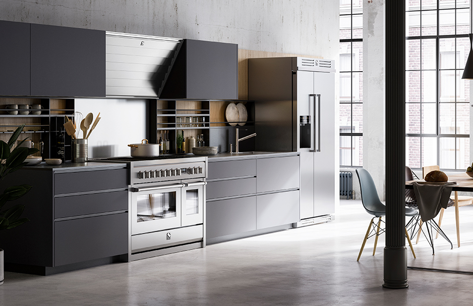 Moderne Einbauküche in Grau mit Edelstahlgeräten und Essbereich, hell und stilvoll eingerichtet Große, moderne Küche mit grauen Fronten, Edelstahlherd, Dunstabzugshaube, Kühlschrank mit Doppeltür und hellem Essbereich im Loft-Stil